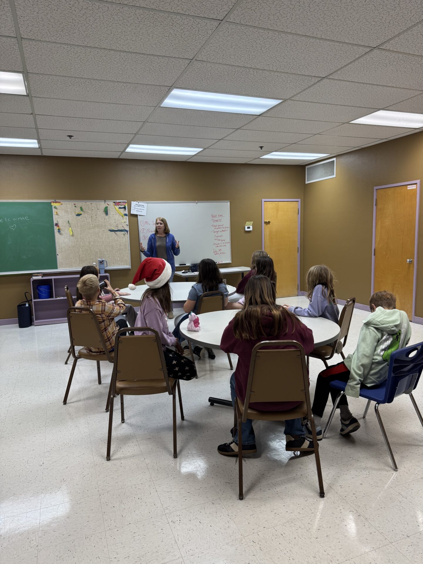 Kids in a classroom listening during BeTween time